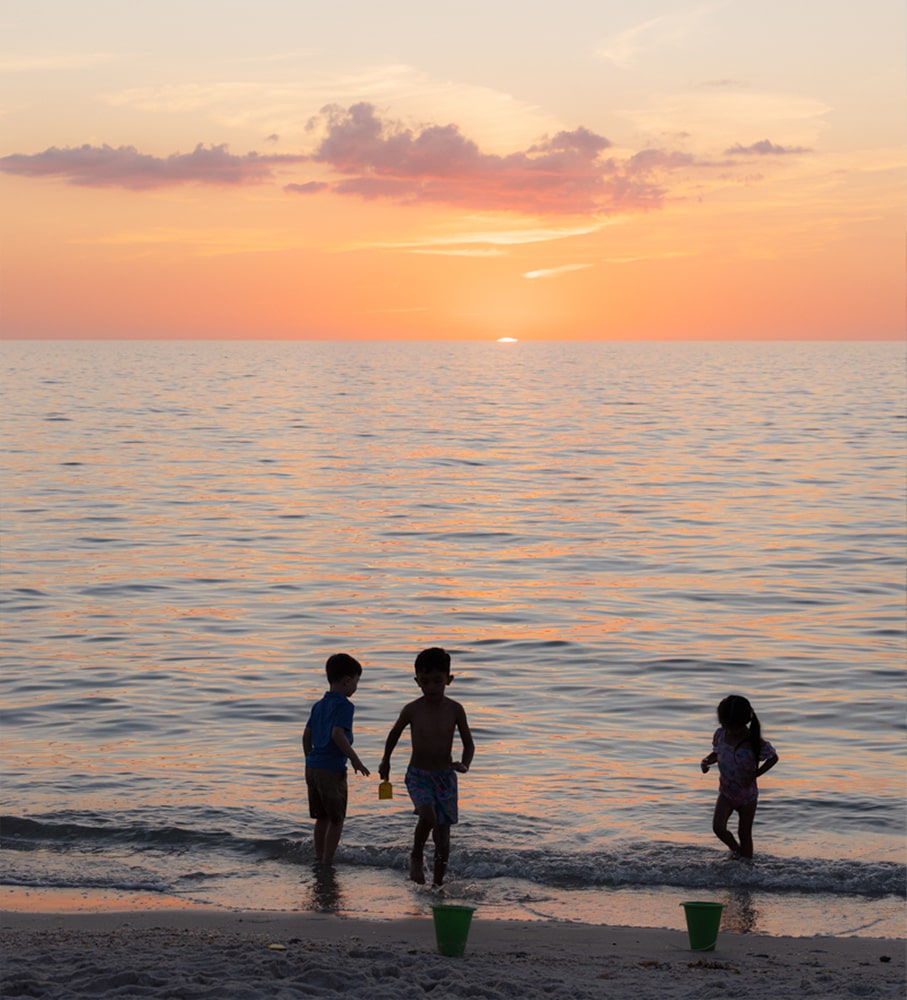 kids playing in the ocean